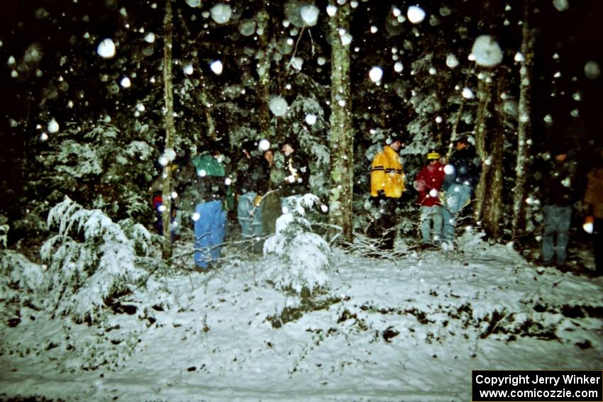 Spectators standing at the s-curve in the snow on SS8, Bob Lake II.