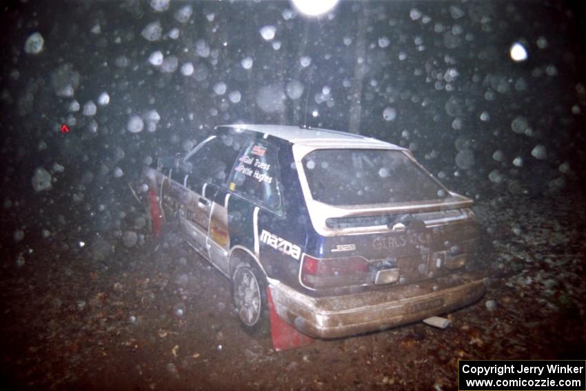 Gail Truess / Pattie Hughes Mazda 323GTX crashed heavily into a tree at the flying finish of SS5, Passmore.