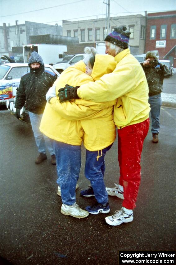 Mark Utecht, Brenda Corneliusen and Al Kintigh perform a group hug to stay warm at parc expose in Calumet on day two.