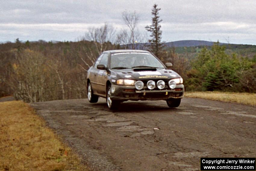 Pat Richard / Claire Chizma Subaru Impreza 2.5RS at the final yump on SS14, Brockway Mountain I.