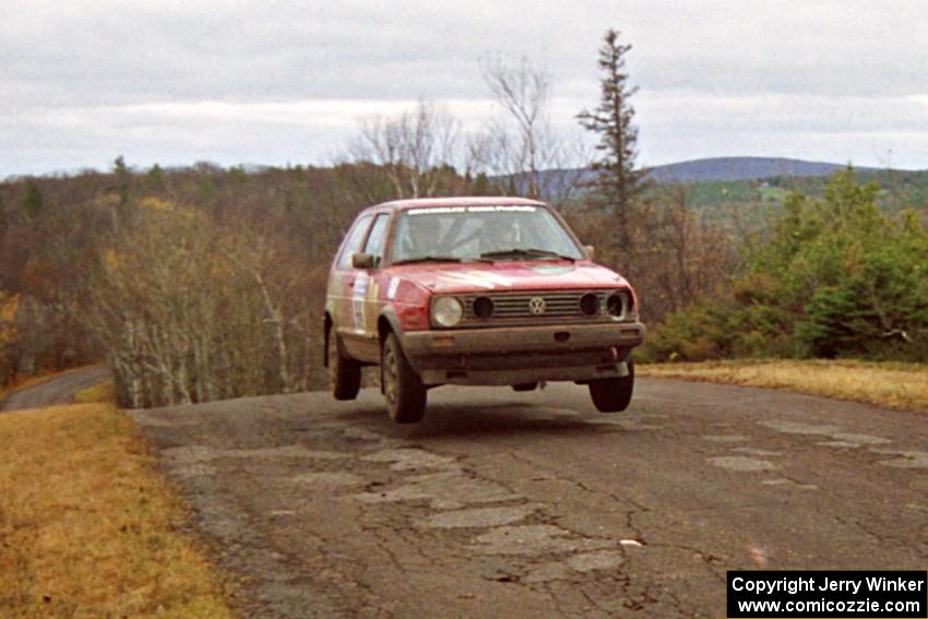 Richard Pilczuk / Brian Pilczuk VW GTI at the final yump on SS14, Brockway Mountain I.