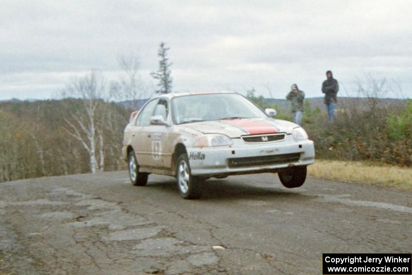 Jay Kowalik / Tom Tighe Honda Civic at the final yump on SS14, Brockway Mountain I.