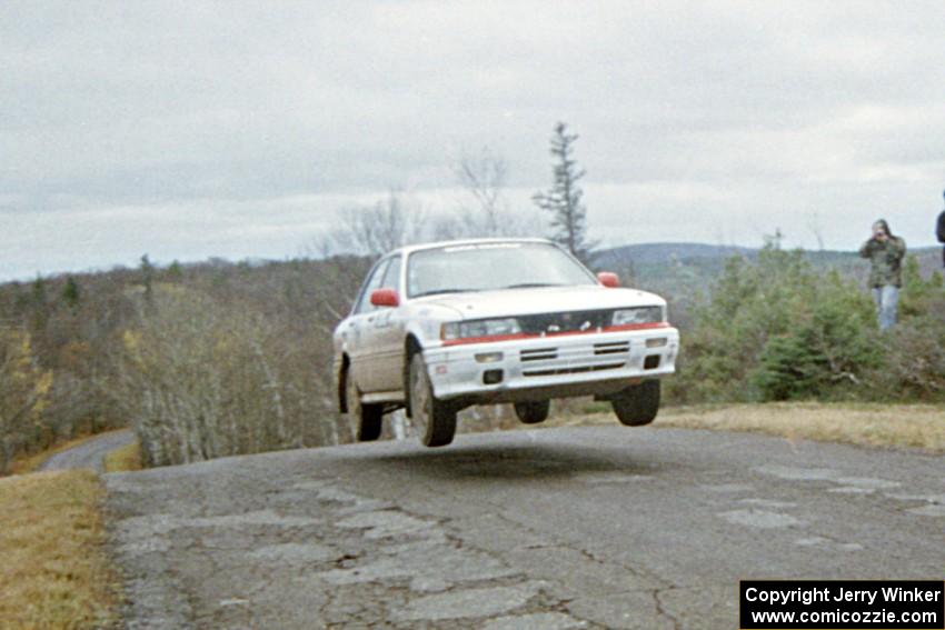 Todd Jarvey / Rich Faber Mitsubishi Galant VR-4 at the final yump on SS14, Brockway Mountain I.