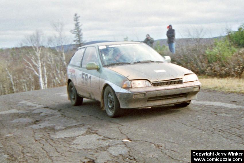 Pete Beaupre / Dave Cizmas Suzuki Swift at the final yump on SS14, Brockway Mountain I.