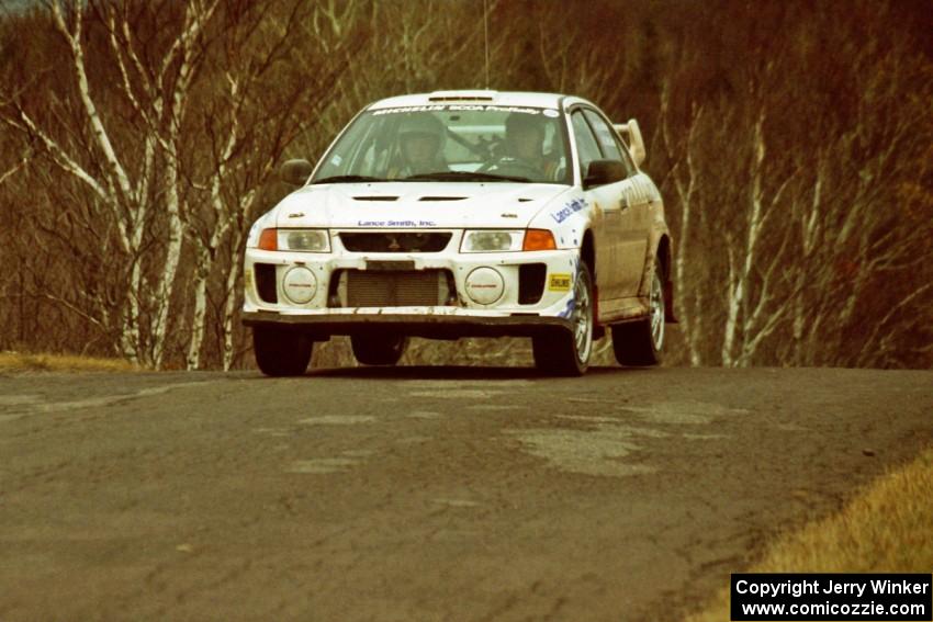 Karl Scheible / Gail McGuire Mitsubishi Lancer Evo V at the final yump on SS14, Brockway Mountain I.