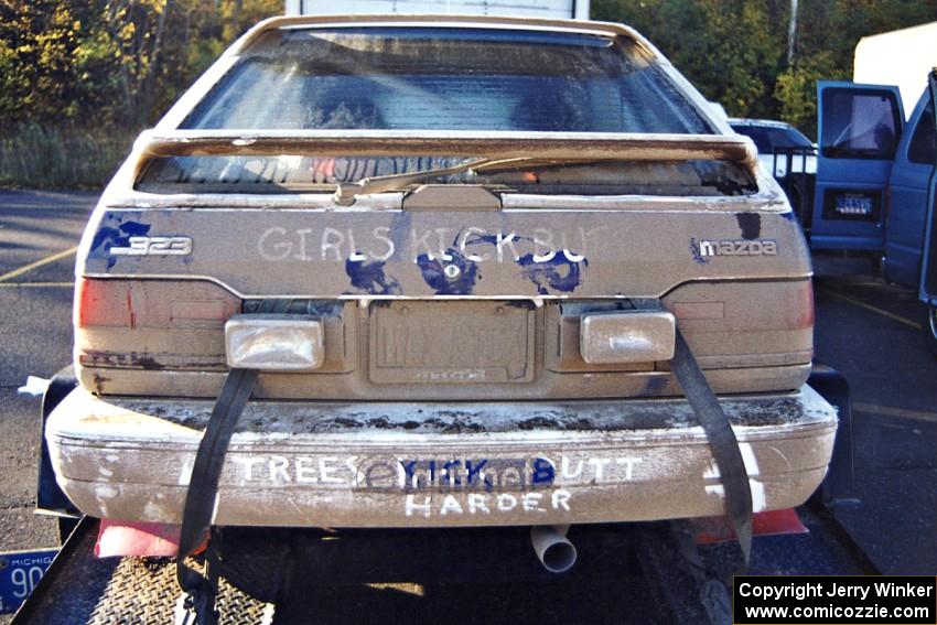 Gail Truess / Pattie Hughes Mazda 323GTX on the trailer after the rally