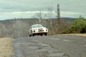 Karl Scheible / Gail McGuire Mitsubishi Lancer Evo V at the final yump on SS15, Brockway Mountain II.