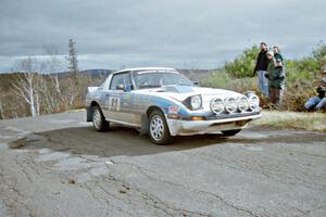 Mike Hurst / Rob Bohn Mazda RX-7 at the final yump on SS15, Brockway Mountain II.