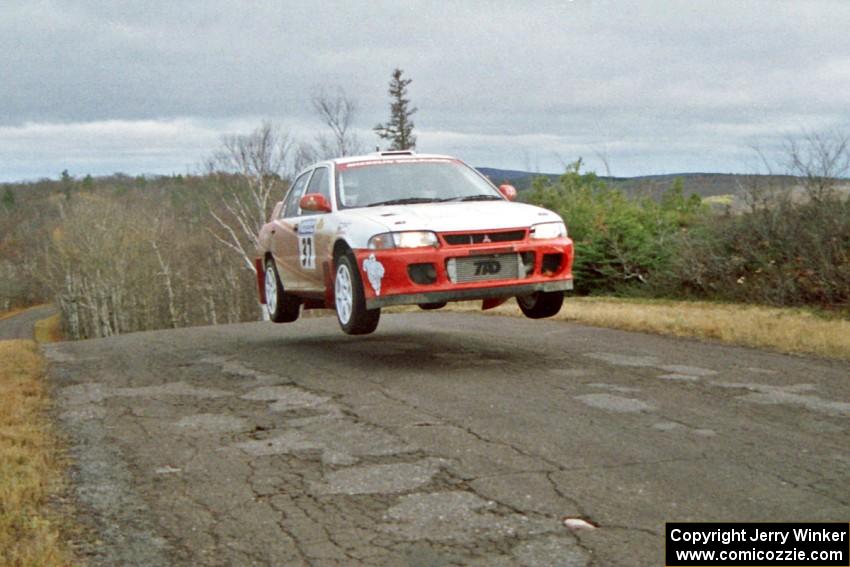 Henry Joy IV / Chris Griffin Mitsubishi Lancer Evo II at the final yump on SS15, Brockway Mountain II.