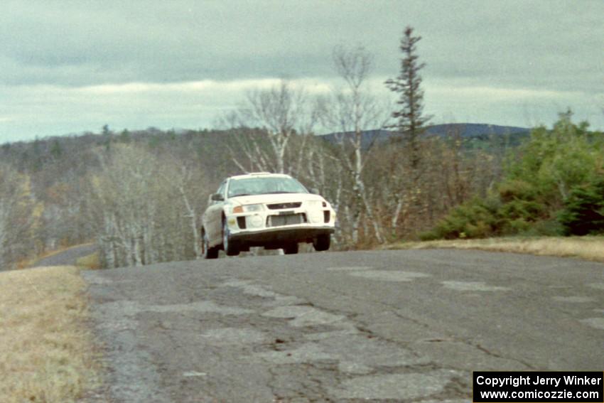 Karl Scheible / Gail McGuire Mitsubishi Lancer Evo V at the final yump on SS15, Brockway Mountain II.