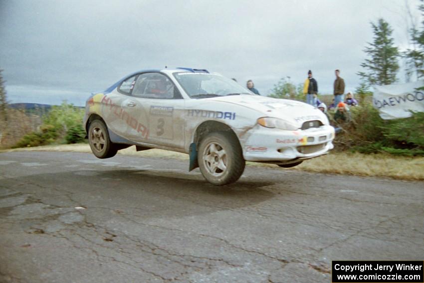 Paul Choiniere / Jeff Becker Hyundai Tiburon at the final yump on SS15, Brockway Mountain II.