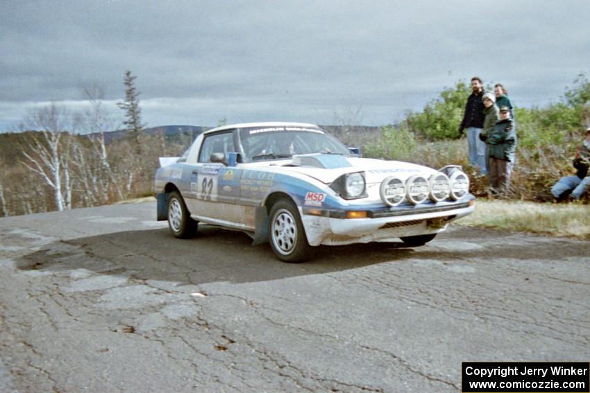 Mike Hurst / Rob Bohn Mazda RX-7 at the final yump on SS15, Brockway Mountain II.