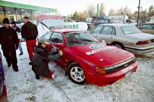 The Paul Dunn / Brian Jenkins Toyota Celica All-Trac gets stickers added to it in the parking lot before parc expose.
