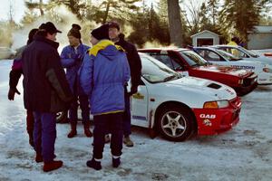 Drivers chat near the Garen Shrader / Doc Shrader Mitsubishi Lancer Evo IV.