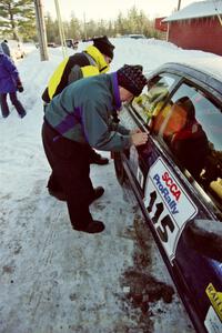 Last minute stickers are added to the Seamus Burke / Frank Cunningham Subaru WRX at parc expose.