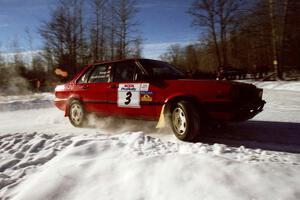 The Jon Kemp / Rod Hendricksen Audi 4000 Quattro drifts past spectators on SS1, Hungry 5. They were an early DNF.