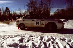 Pete Lahm / Matt Chester drift their Mitsubishi Lancer Evo IV past spectators on SS1, Hungry 5.