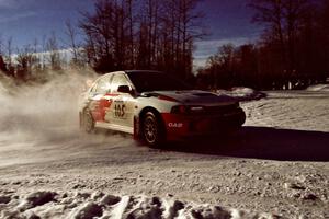 Bill Morton / Rob Walden drift past spectators on SS1, Hungry 5, in their Mitsubishi Lancer Evo IV.