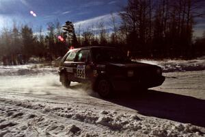 The Colin McCleery / Jeff Secor VW GTI drifts past spectators on SS1, Hungry 5.