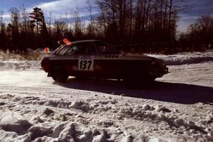 The Phil Smith / Dallas Smith MGB-GT drifts past spectators on SS1, Hungry 5. They retired early.