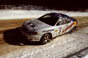 Paul Choiniere / Jeff Becker at speed on SS5, Avery Lake I, in their Hyundai Tiburon.