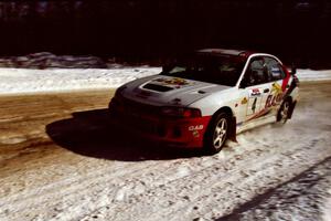 Garen Shrader / Doc Shrader at speed on SS5, Avery Lake I, in their Mitsubishi Lancer Evo IV.