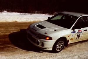 Pete Lahm / Matt Chester drift their Mitsubishi Lancer Evo IV at speed through a fast sweeper on SS5, Avery Lake I.