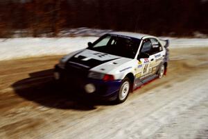 The Karl Scheible / Russ Hughes Mitsubishi Lancer Evo V at speed on SS5, Avery Lake I.