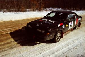 The Mike Hurst / Rob Bohn Pontiac Sunbird Turbo at speed on SS5, Avery Lake I.