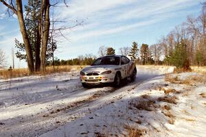 The Paul Choiniere / Jeff Becker Hyundai Tiburon comes over a small crest on SS7, Ranch II.