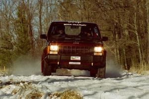 Scott Carlborn / Dale Dewald set up for the hairpin on SS7, Ranch II, in their Jeep Comanche.