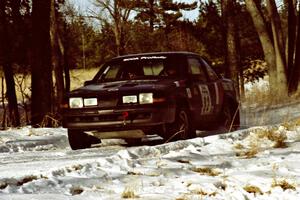 The Mike Hurst / Rob Bohn Pontiac Sunbird Turbo at speed on SS7, Ranch II.