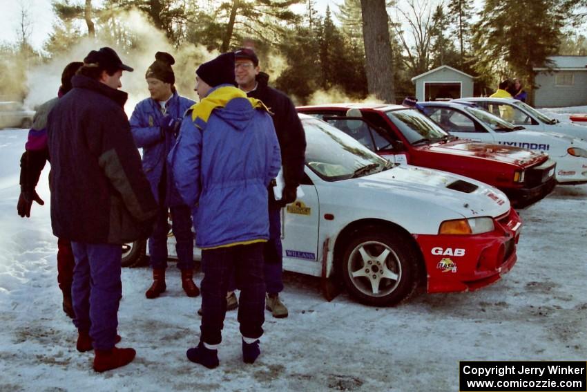 Drivers chat near the Garen Shrader / Doc Shrader Mitsubishi Lancer Evo IV.