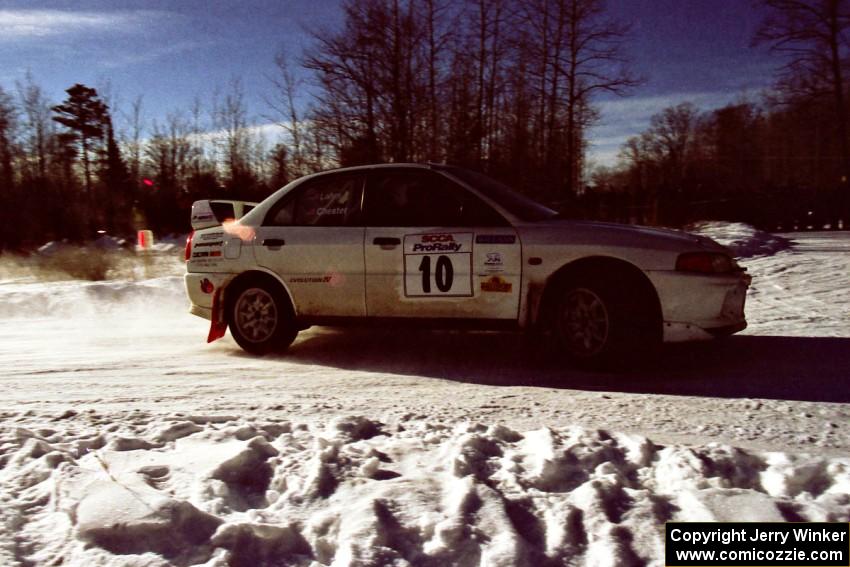 Pete Lahm / Matt Chester drift their Mitsubishi Lancer Evo IV past spectators on SS1, Hungry 5.