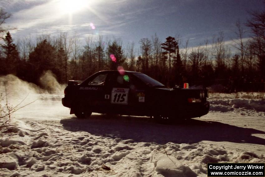 Seamus Burke / Frank Cunningham drift past spectators on SS1, Hungry 5, in their Subaru WRX.