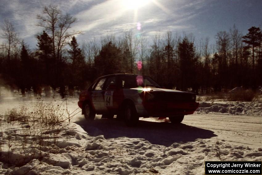 Sylvester Stepniewski / Adam Pelc drift past spectators on SS1, Hungry 5, in their Audi 4000 Quattro.