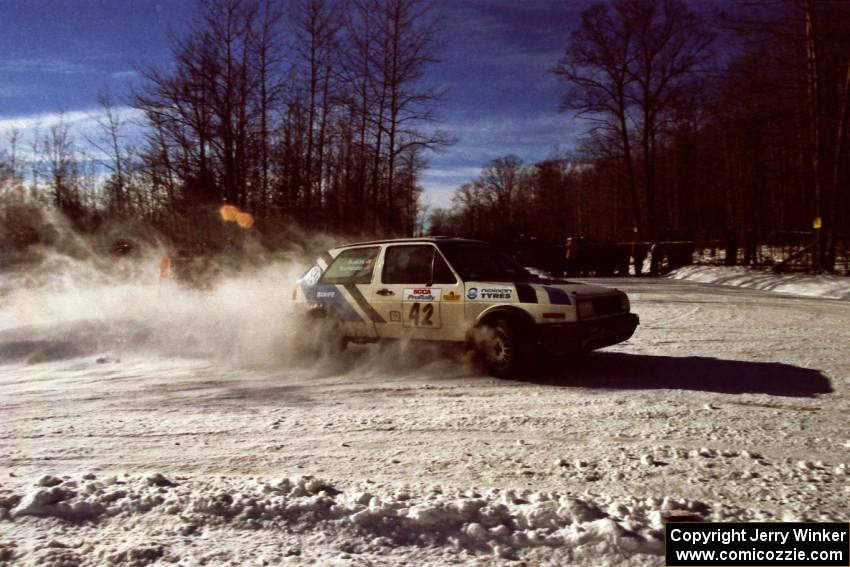 The Eric Burmeister / Mark Buskirk VW GTI drifts past spectators on SS1, Hungry 5.