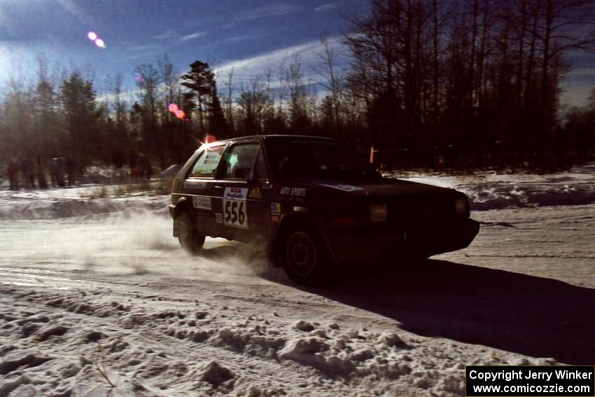 The Colin McCleery / Jeff Secor VW GTI drifts past spectators on SS1, Hungry 5.