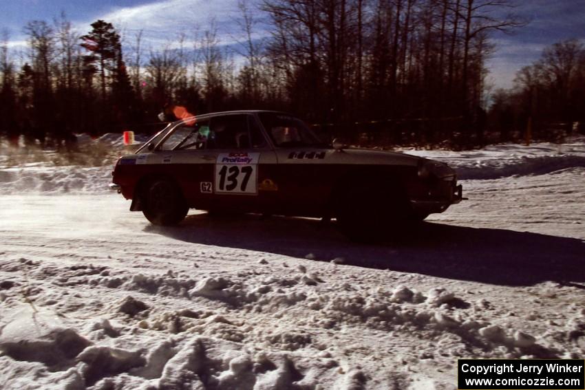 The Phil Smith / Dallas Smith MGB-GT drifts past spectators on SS1, Hungry 5. They retired early.