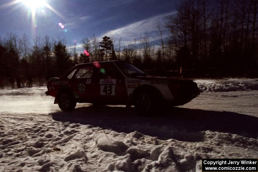 Carlos Arrieta, Sr. / Dick Casey drift past spectators on SS1, Hungry 5, in their Audi 4000 Quattro.