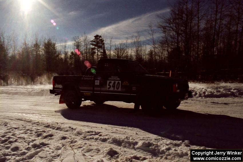 Scott Carlborn / Dale Dewald drive past spectators on SS1, Hungry 5, in their Jeep Comanche.