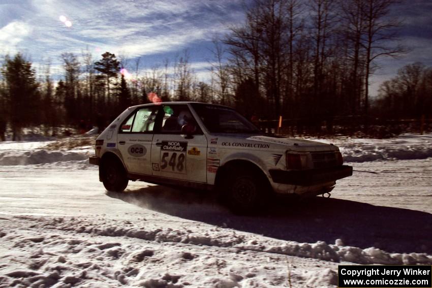 John Zoerner / John Shepski drift past spectators on SS1, Hungry 5, in their Dodge Omni GLH-Turbo.