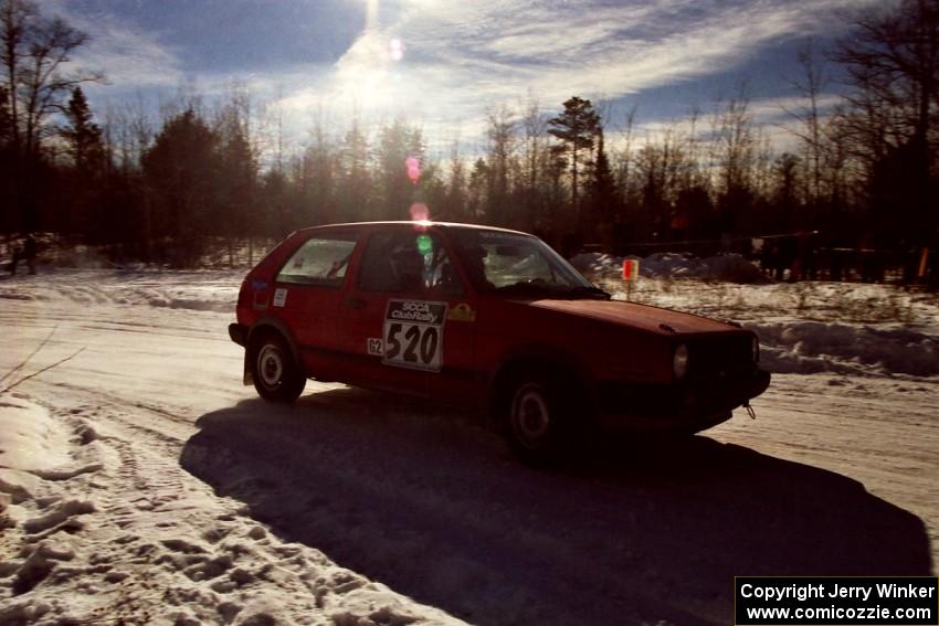 The Josh Scott / Roxanne Slancik VW GTI drifts past spectators on SS1, Hungry 5.