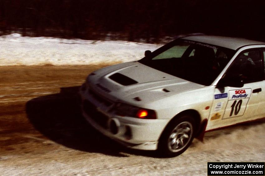 Pete Lahm / Matt Chester drift their Mitsubishi Lancer Evo IV at speed through a fast sweeper on SS5, Avery Lake I.