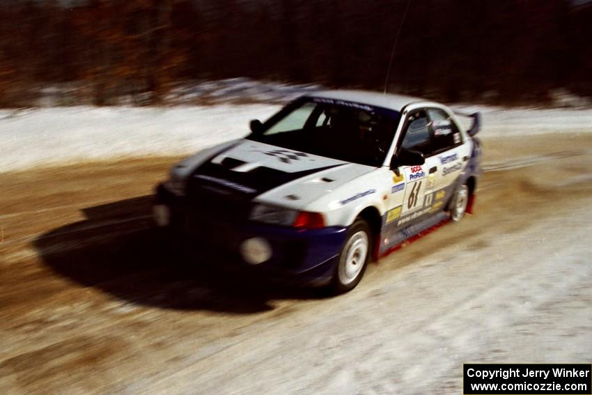 The Karl Scheible / Russ Hughes Mitsubishi Lancer Evo V at speed on SS5, Avery Lake I.