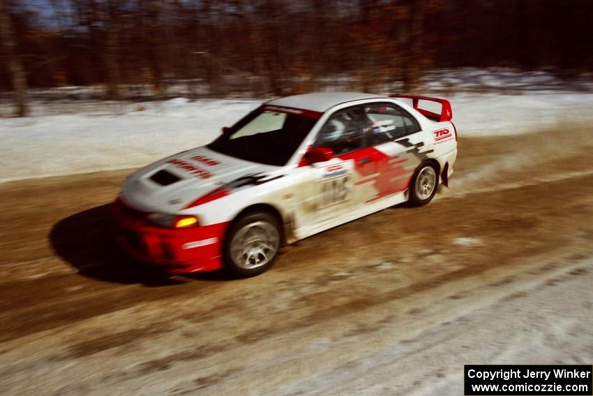 Bill Morton / Rob Walden at speed on SS5, Avery Lake I, in their Mitsubishi Lancer Evo IV.