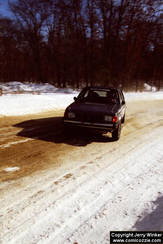 The Mark Utecht / Brenda Corneliusen Dodge Omni GLH-Turbo at speed on SS5, Avery Lake I.