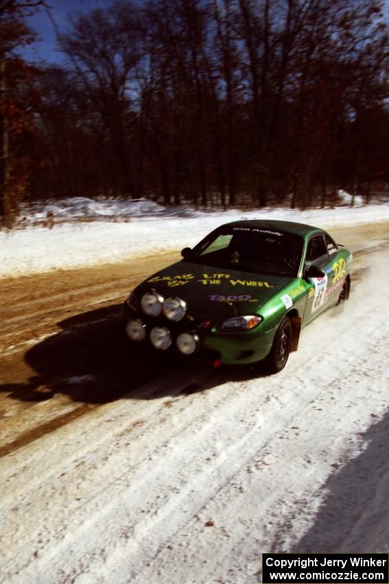 Tad Ohtake / Cindy Krolikowski at speed on SS5, Avery Lake I, in their Ford Escort ZX2.