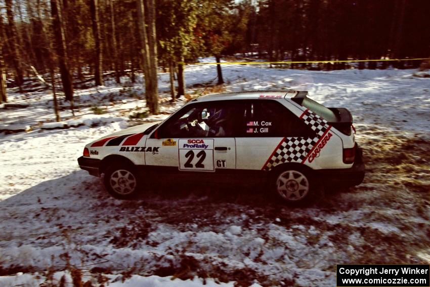 Mark Cox / Jim Gill take the hairpin on SS7, Ranch II, in their Mazda 323GTX.