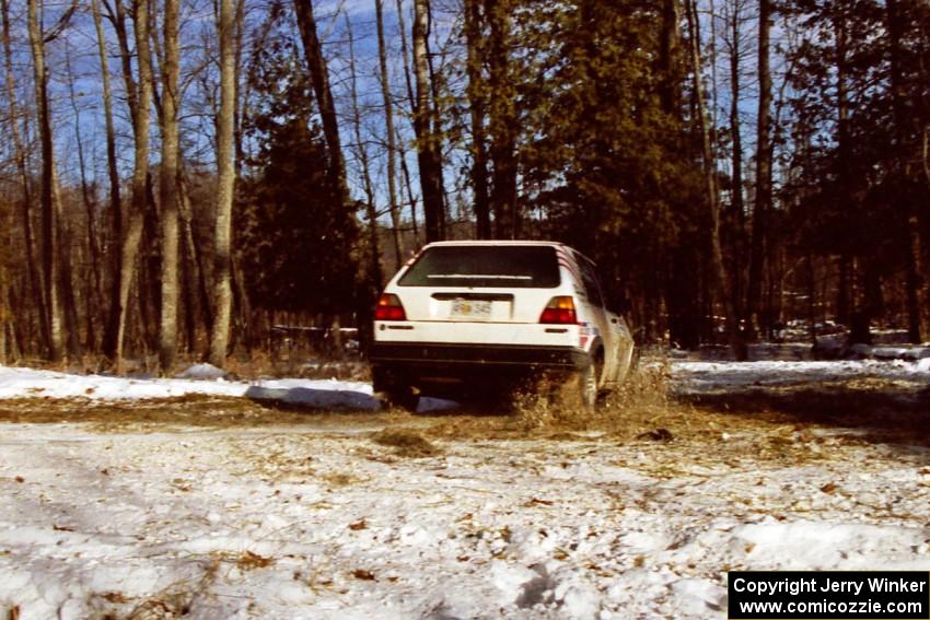 The Doug Davenport / Lea Hoffa VW Golf hits the hairpin on SS7, Ranch II.